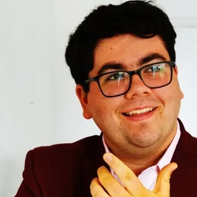 Ross Cowan profile image man with glassses