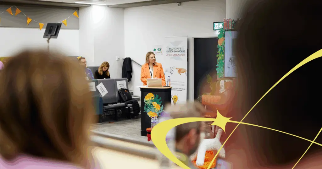 Clare Daly speaking wearing a bright orange top