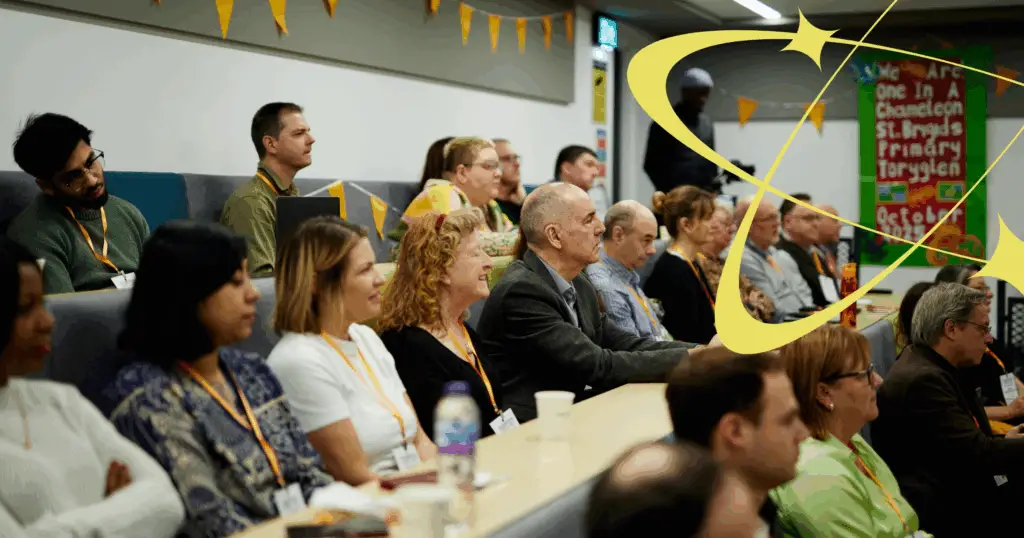 A group of people sitting and listening